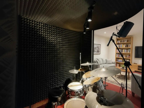 24 Pack Hella Thick Acoustic Foam Panels Crafted To Knock Out Studio Reverb And Quiet Down Busy Rooms For Home Offices Creative Spaces And Relaxing Lounges Premium Density Tiles in a drum studio.