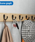 Stainless Steel Wall Hooks A Badass 10 Piece Set For Hanging Coats Robes And Heavy Duty Screw Mount Holder For Bedroom Kitchen Bathroom Decor Plus Super Slick Finish And Rock Solid Everyday Organization System with black hooks on wooden panel hanging coats and accessories.