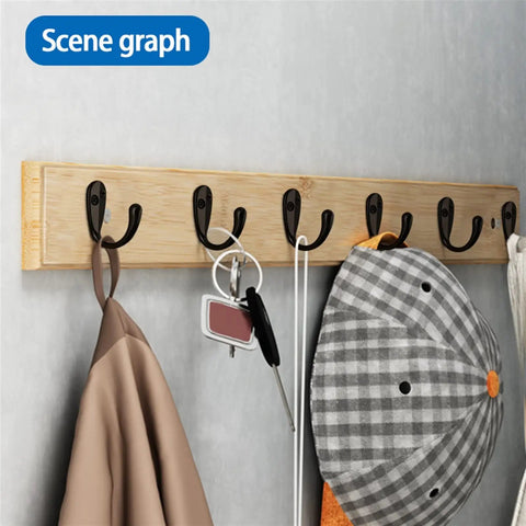 Stainless Steel Wall Hooks A Badass 10 Piece Set For Hanging Coats Robes And Heavy Duty Screw Mount Holder For Bedroom Kitchen Bathroom Decor Plus Super Slick Finish And Rock Solid Everyday Organization System with black hooks on wooden panel hanging coats and accessories.