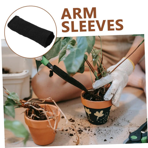 Snag This Badass Pair Of Cut Resistant Arm Sleeves And Heat Guards Designed For Gardening Welding Mechanics Or Carpentry To Keep Your Arms Cool Protected All Day Long. Black knit arm sleeves displayed with gardening plants.