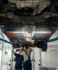 Dope Rechargeable Cordless Underhood Work Light Bar With 2300 Lumens installed under car in garage setting