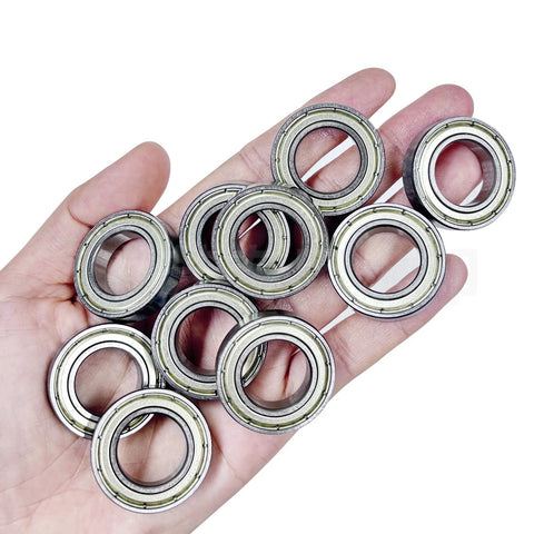 Hand holding 10 precision 6806ZZ ball bearings for robotics and drones