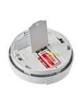 Hardwired Heat Detector With Battery Backup And Dual LEDs, showing open battery compartment with 9V battery, for garage safety.