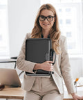 Woman holding Rugged Hard Shell Fireproof File Organizer With Lock 13 Pocket Accordion Folder in office setting.