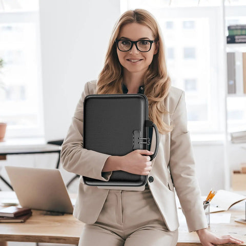 Woman holding Rugged Hard Shell Fireproof File Organizer With Lock 13 Pocket Accordion Folder in office setting.
