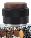 Top Tier 51Mm Black Coffee Distributor And Espresso Tamper For Baristas Stainless Steel Tool with wooden top and coffee grounds.
