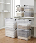 No Fuss Big 40 Pack 90 Qt Clear Plastic Storage Bins With Snap Lock Lids stacked, holding neatly folded towels, for home organization.