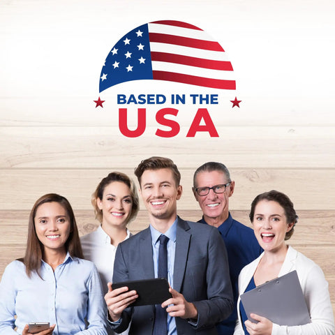 Group of diverse professionals smiling together under 'Based in the USA' banner, showcasing teamwork and positivity.