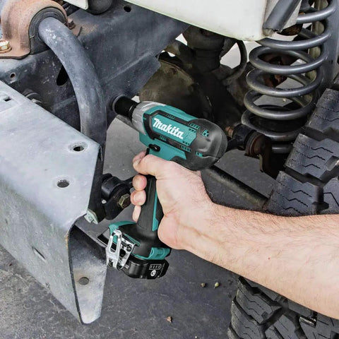 Using 12V Max CXT Impact Wrench Kit With Ultra Compact Six Inch Body on vehicle suspension, ergonomic grip visible