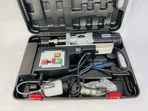 Black 60mm Magnetic Drill With Rock Solid 52 Lb Base Two Speed Reversible Motor Heavy Duty Steel Working Beast Built Tough For Tough Jobs Includes Mt3 Arbor And Quick Change Adapters Straight Shooting Power Delivery in carrying case.
