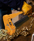 Person using Beefy Heavy Duty Folding Handle Load Binder Set Five Sixteenths To Three Eighths Inch Ratchet Chain Binders With Grab Hooks