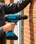 Man using Rock Solid 21V Cordless Drill And Electric Screwdriver With Quick Lithium Battery for drilling into brick wall.