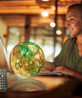 Levitating Galaxy Moon Lamp With Remote And Magnetic Base in 18 colors, floating above a wooden desk, ideal for office decor