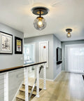 Sleek 1 Light Mini Glass Globe Ceiling Light in Black Finish Semi Flush Mount for Hallways Porches Aisles Stairways and Closets