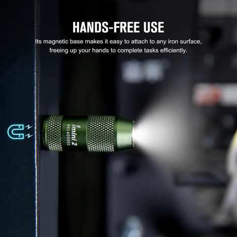 Mini USB Rechargeable Keychain Flashlight With 50 Lumen Output attached magnetically, emitting light, durable OD Green body