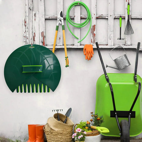 Garden tools against an outdoor wall with Tough As Nails Adjustable 43 To 63 Inch Long Turf Rake with 18 Inch wide head visible
