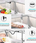 Top Tier Kitchen Sink Faucet Featuring A Smooth Pull Down Sprayer Integrated Soap Dispenser And Heavy Duty Brushed Finish for rinsing vegetables.