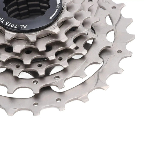 Close-up view of 6 speed bicycle cassette with low noise and smooth rotation, durable stainless steel and aluminum alloy gear set