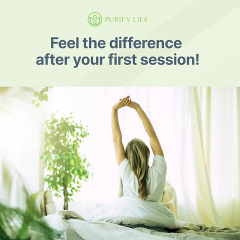 Woman stretching arms upward on a bed, with sunlight streaming through curtains, promoting relaxation and well-being.