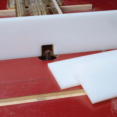 4 In X 48 In X 3/8 In UHMW Plastic Sheet on router table, showing smooth sliding surface and cutting board grade material