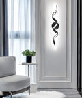 Dimmable 24 Inch Black LED Vanity Light With Dope Spiral Design For Over Mirror Install Modern Bath Lighting Fixture 15W Low Profile 6000K Daylight White Wall Mount installed on a wall in a modern room.