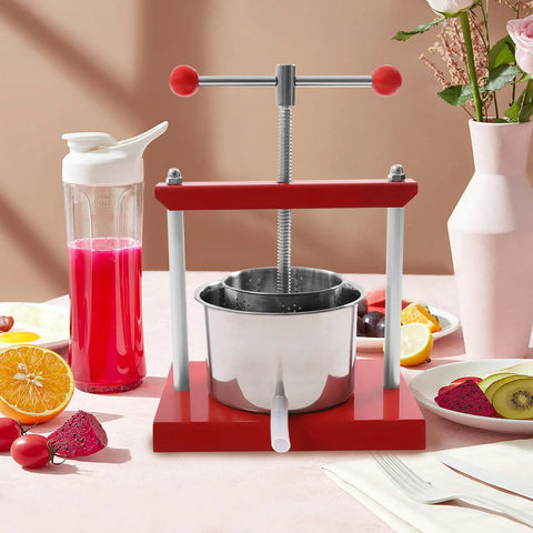 Heavy Duty Manual Fruit Wine Press Built Like A Tank Food Grade Stainless Steel Apple Grape Juicer on table with fruits.