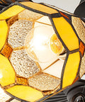 Close-up of striking stained glass shade illuminated on Top Shelf Retro European Ceiling Fan With Remote Control And Striking Stained Glass Shade On A Rock Solid Base Featuring Five Eco Friendly Blades And A Flip Style Reversible Motor To Keep The Good Vibes Rolling In Bedrooms Or Living Rooms At 52 Inches.