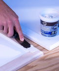 Applying Premium White Wood Filler 16 Oz 3 In 1 Stainable Grain Filler And Sealer Coat Pro Grade Acrylic Latex with putty knife