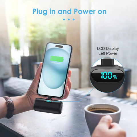 Person using Compact USB C Power Bank With Built In USB C Connector 5000mAh PD Fast Charging Battery Pack, LCD showing 100% charge.