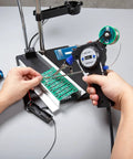 Person using Industrial Automatic Soldering Gun Kit With Digital Display And Temperature Control Motorized Solder Wire Feed