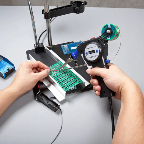 Person using Industrial Automatic Soldering Gun Kit With Digital Display And Temperature Control Motorized Solder Wire Feed
