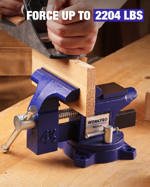 Heavy Duty 4.5 Inch Bench Vise With Multi Jaw For Flat Materials And Pipes Built Tough in use on a workbench holding wood securely.