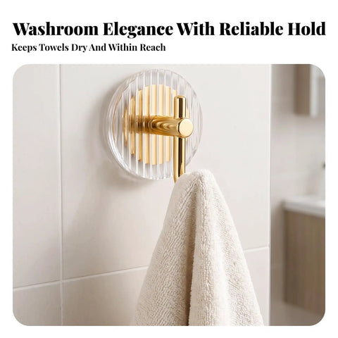 Kick Clutter To The Curb With This Slick Space Saving Wall Hook Designed To Ace Your Entryway Organization Game While Keeping Bathrooms And Bedrooms Tidy Without Taking Up Any Extra Room, featuring a gold metal hook on a striped acrylic background holding a towel.