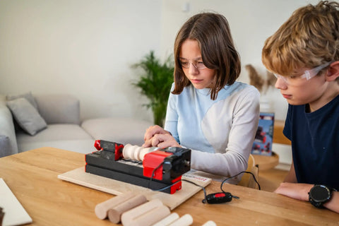 Children using 4-In-1 Woodworking Kit For Kids Ages 8 And Up Lathe Drill Sander And Saw STEM DIY Project Tool Set at home