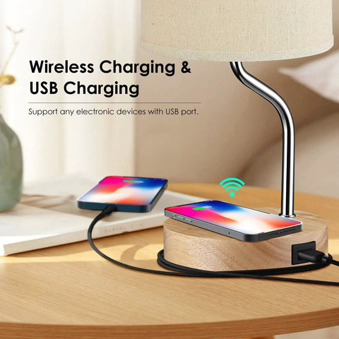 Set Of 2 Smart Bedside Table Lamps With Wireless Charging Pad And USB Port on wooden base in a modern bedroom setting.