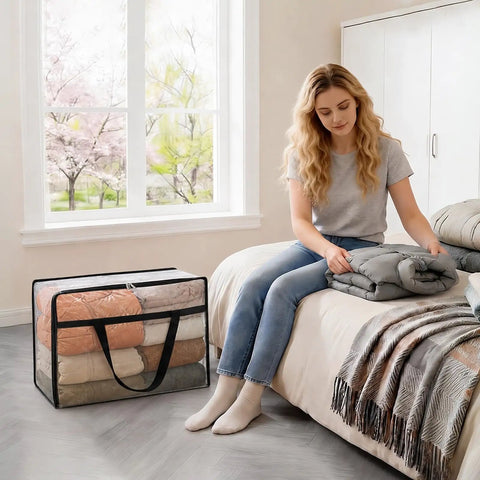 Woman arranging bedding using Roomy Clear Storage Sacks, Heavy Duty 60L Zippered Packing Bags For Seasonal Clothes And Bedding.