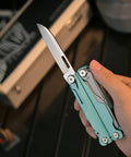 Hand holding 20 In 1 EDC Multi Tool Pliers With Spring Loaded Pliers Head showing straight blade, blue handle visible