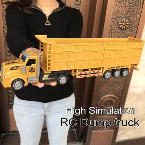 RC Dump Truck With Trailer One To Forty Eight Scale 14 Inch Mini Semi Truck Toy held by person demonstrating size and detail