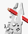 Close-up of Pro Grade Badass Heavy Duty Foldable Wire Stripper showing red wire and measurement markings for various gauge sizes.