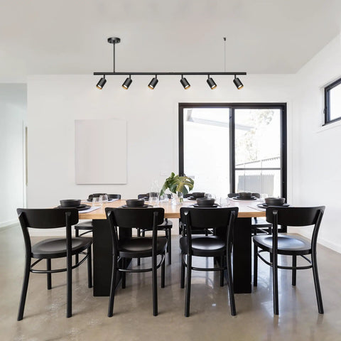 Dining room with Globe Electric 64000123 55" 6-Light Adjustable Height Track Light, Matte Black, installed over table.