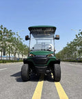 Green Four Seater Electric Golf Cart Patrol Cart Featuring Smooth Independent Suspension And Comfy Bolted Down Seats Built For Lazy Weekend Cruises night time view on a sunny road.