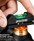 Close-up of Pro Grade High Precision Scope Leveling Kit with magnetic bubble level mount on Picatinny rail, durable black.