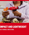 Person using V20 Mini Cordless Hot Glue Gun With LED Light And Sticks Set for crafting, compact red design, dual temperature control.
