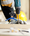 Beefy Woodworking T Slot Clamp With T Track Hold Down Screw Blue Quick Act Carpenter Clamp securing wood piece