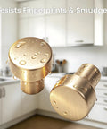 Brushed Gold Round Cabinet Knobs Set Of 10 Zinc Alloy Single Hole Drawer Pulls in a kitchen, close-up with water droplets.