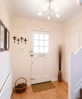 Built Like A Tank Cast Iron Wall Mount Key Hooks For Entryway And Garage Featuring Classic Fleur De Lis Charm Dark Brown coat hooks on wall.