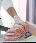 Chef using Six Pcs Diamond Sharpening Hones Set With Color Coded Diamond Stones for knife sharpening, cutting sliced ham.