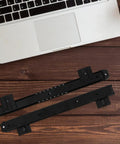 Heavy Duty Keyboard Tray Slide Rail For Computer Desk Runs Slick As Butter With Premium Glide Track Drawer Guide For Daily Typing And Solid Home Office Setup, black steel glide track positioned on wooden surface.