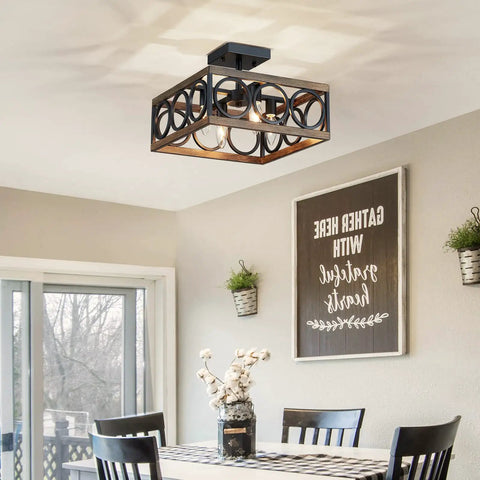 Interior view showing 4 Light Modern Black Square Chandelier with Vintage Wood Grain Finish above dining table.