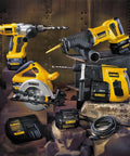 Dewalt power tools set including drills, saw, and battery charger displayed on industrial background with bricks and metal pipes.